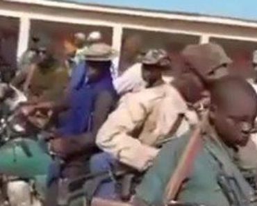 BREAKING: Fulani Men Carrying AK-47 In The Presence Of Army In Katsina (Photos, Video)